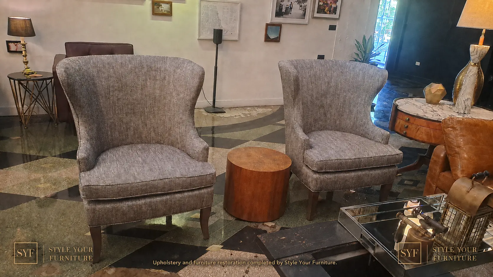 Two restored upholstered wingback chairs in a hotel setting